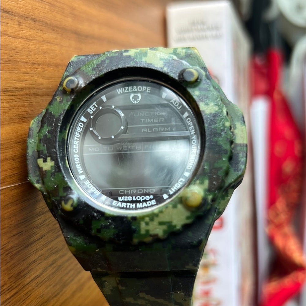 Green Smartwatch with Rugged Design and Digital Display